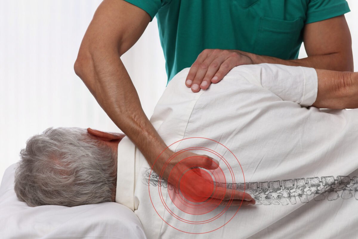 Senior man having chiropractic back adjustment Osteopathy Physiotherapy pain relief concept Natural Knows alternative medicine for dizziness
